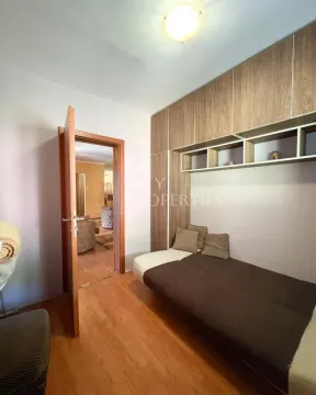 Smaller bedroom with a bed and a built-in wardrobe. - image 2