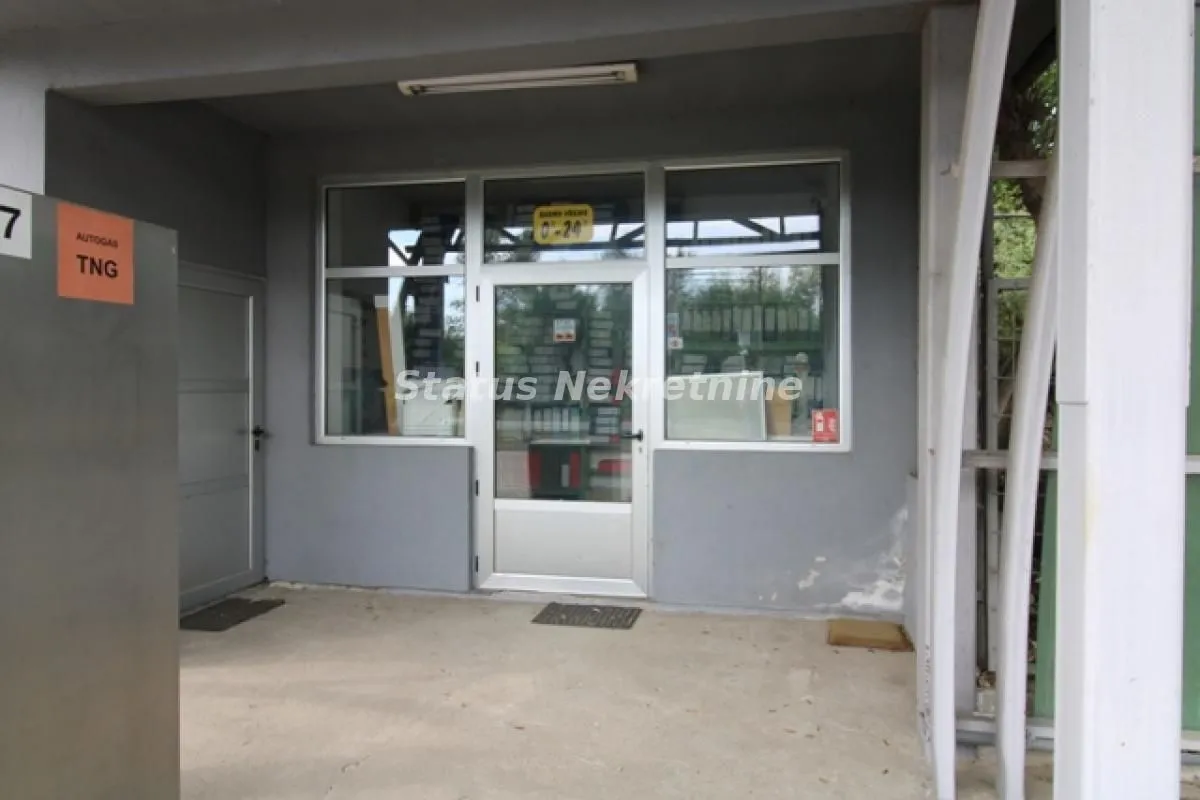 Entrance to commercial space with glass door and shop window.
