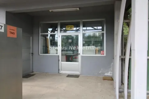 Entrance to commercial space with glass door and shop window. - image 19