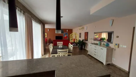 Spacious living room with a dining area and furniture. - image 5