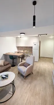Living room connected with the kitchen and dining bar. - image 3