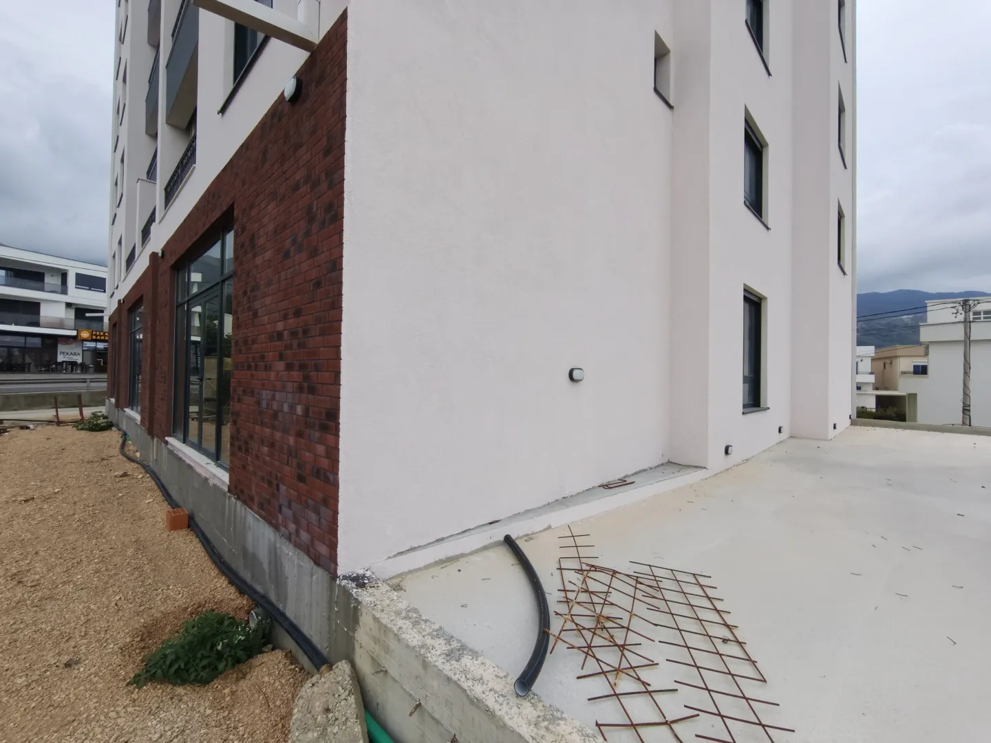 View of the exterior of a modern residential building with brick details.