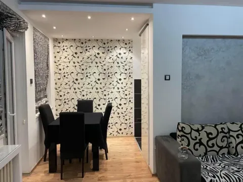 Living room with a dining area and modern furniture. - image 3