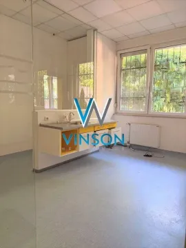 Empty room with kitchen cabinets and a sink by the window. - image 9