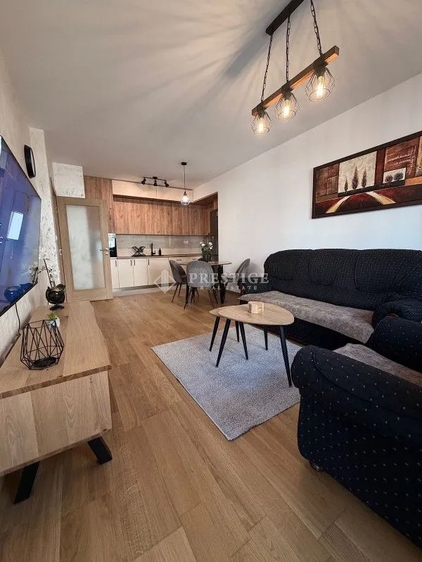 Living room connected with the dining area and kitchen.