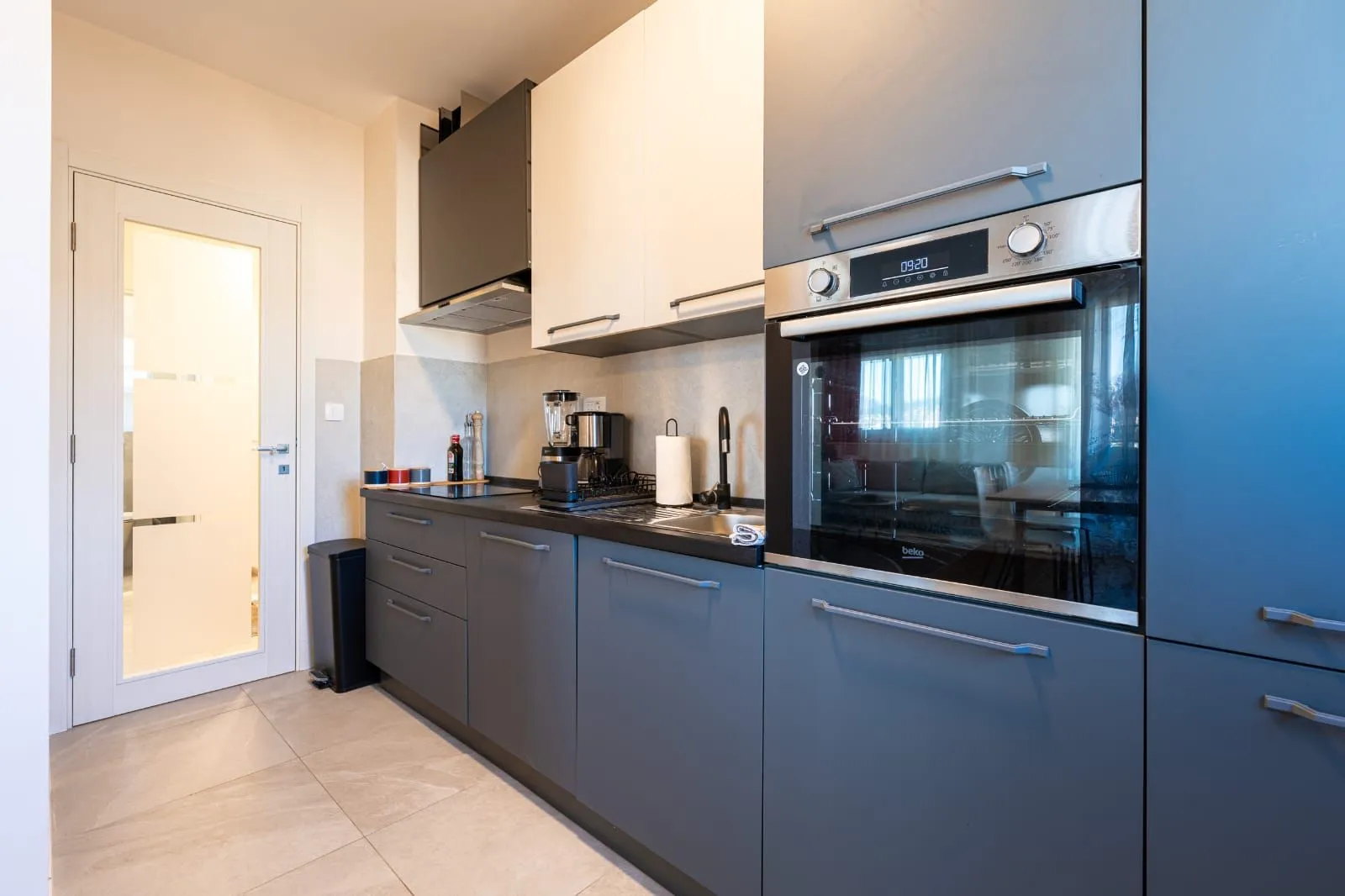 Modern kitchen with built-in appliances and cabinetry.