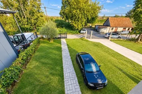 Aerial view of the house yard with lawn, walkway and parked car. - image 5