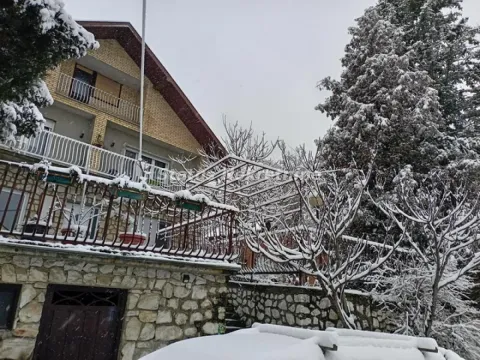 View of the exterior of the house and snow-covered yard. - image 2