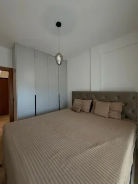 Modern bedroom with a double bed and fitted wardrobe. - image 8