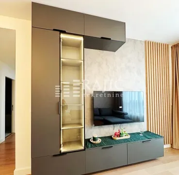 Modern living room with TV unit and built-in elements. - image 10