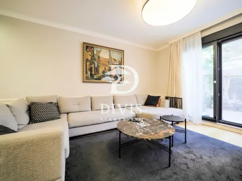 Living room with a sectional sofa, coffee table and access to the terrace. - image 19