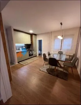 Living room with kitchen and dining area. - image 3