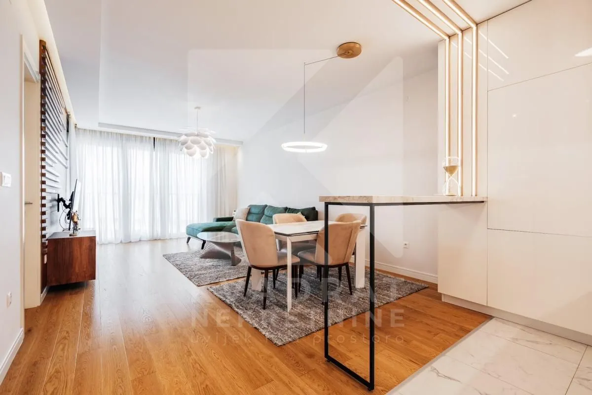 Living room with dining area and modern furniture.