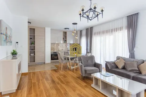 Spacious living room connected to the dining area and kitchen. - image 2