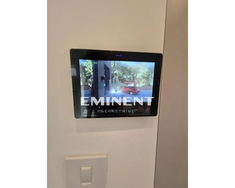Intercom screen mounted on the wall.