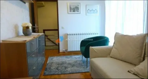 Living room with a sofa, armchair and chest of drawers. - image 13