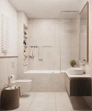 Moderne kupatilo opremljeno kadom, umivaonikom i toaletom u nježnim tonovima. - image 5