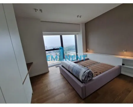 Bedroom with a double bed and a large window. - image 6