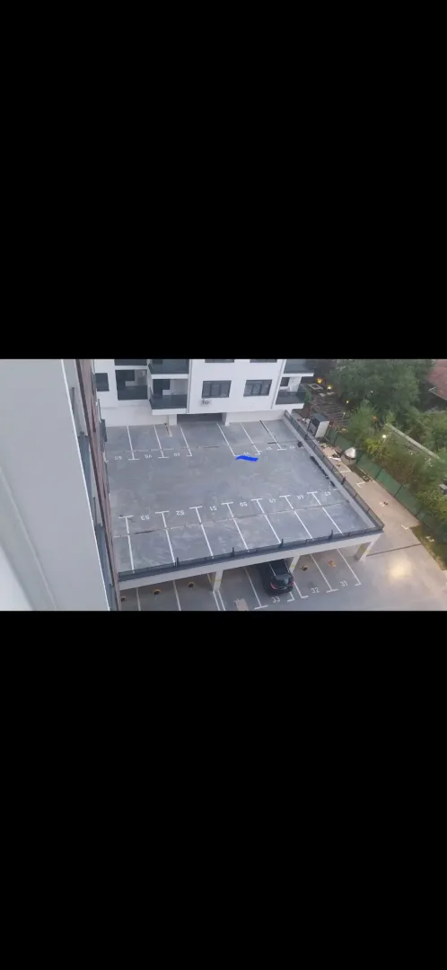 High-angle view of the parking area in front of the building.
