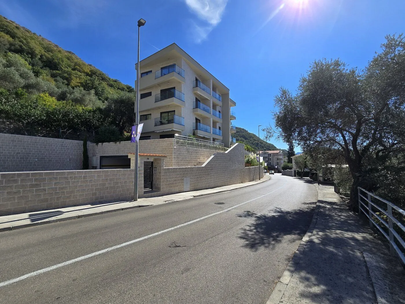 View of a modern apartment building from the street.