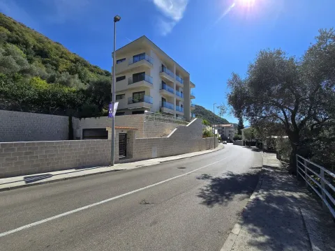 View of a modern apartment building from the street. - image 12