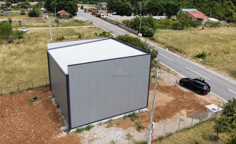 Aerial view of a modern prefabricated building next to the road. - image 3