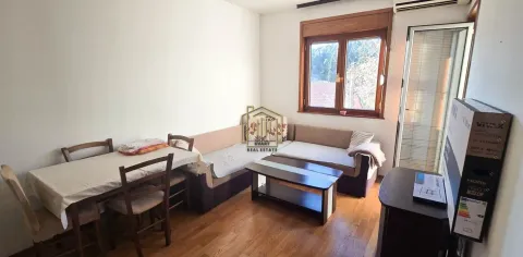 Living room with a sofa set, dining table, and a window. - image 2