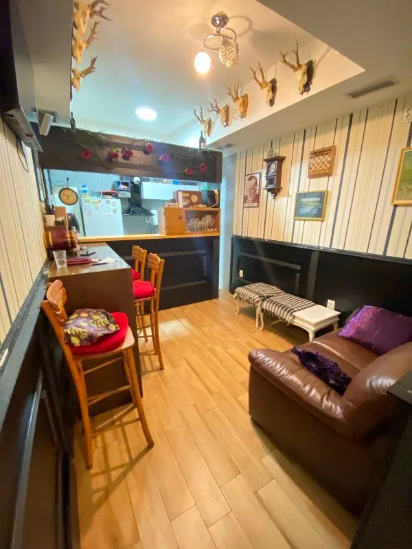 Living room with a bar and seating area.