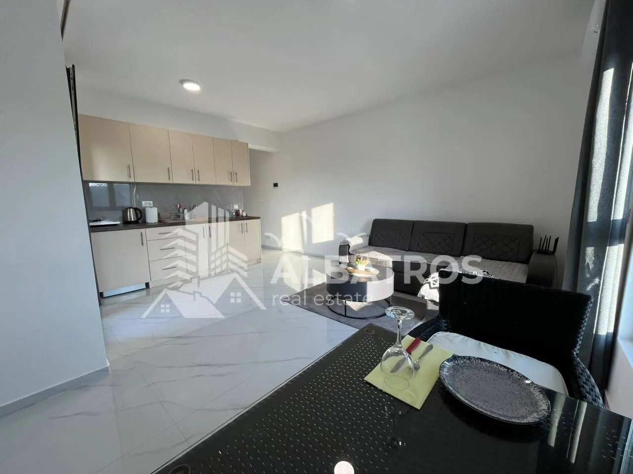 Living room with open-plan kitchen and dining area.
