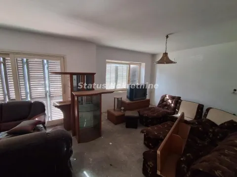 Living room with furniture and large windows with blinds. - image 8