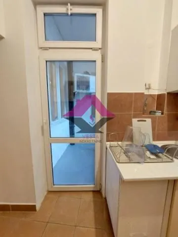 View of the door and the kitchen counter.