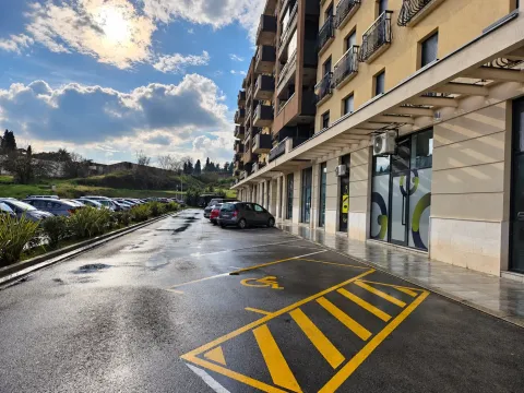 View of the exterior of the building with parking in front. - image 2