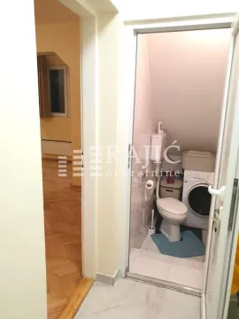 View from the hallway into the bathroom and room. - image 18
