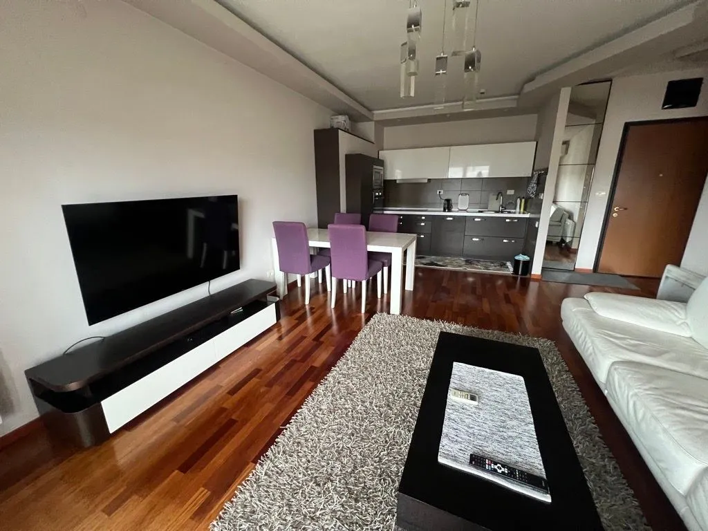 Spacious living room connected to the dining area and kitchen.