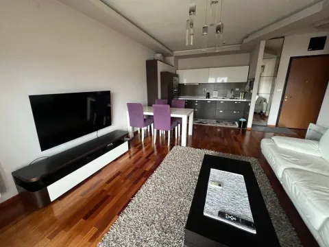 Spacious living room connected to the dining area and kitchen. - image 3