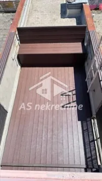 Top-down view of a terrace with wooden decking and a bench. - image 24