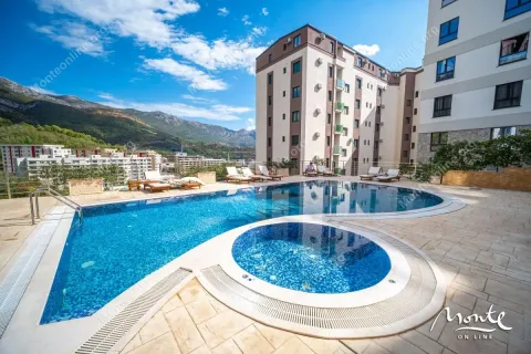 Outdoor swimming pool with sun loungers and mountain view in front of the residential building. - image 3