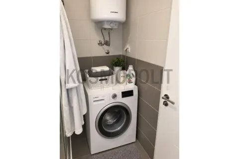 Bathroom with a washing machine and water heater. - image 7