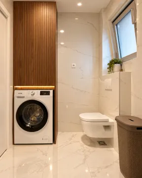 Modernly equipped bathroom with a built-in washing machine and sanitary fixtures. - image 7