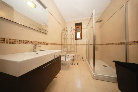 Modern bathroom with a sink and a shower cabin. - image 10