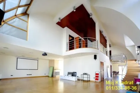 Spacious living room with high ceiling, gallery and staircase. - image 3