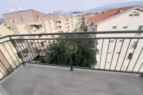 View from the balcony overlooking surrounding buildings and the neighborhood. - image 7