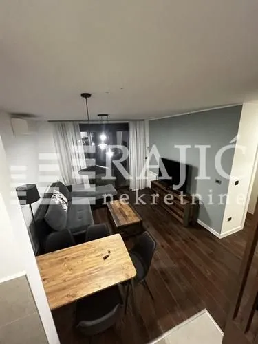 Living room with dining area and sofa set.