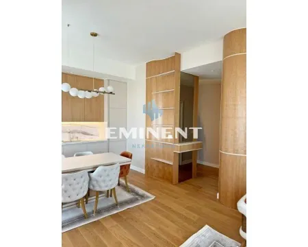 Modern kitchen with dining area and wooden wall panels. - image 6