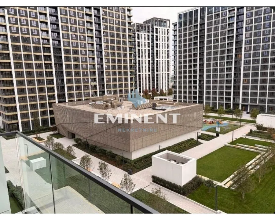 View from the terrace overlooking the courtyard and surrounding residential buildings.