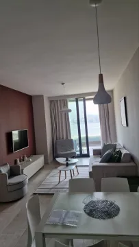 Living room with dining area and sea view. - image 2