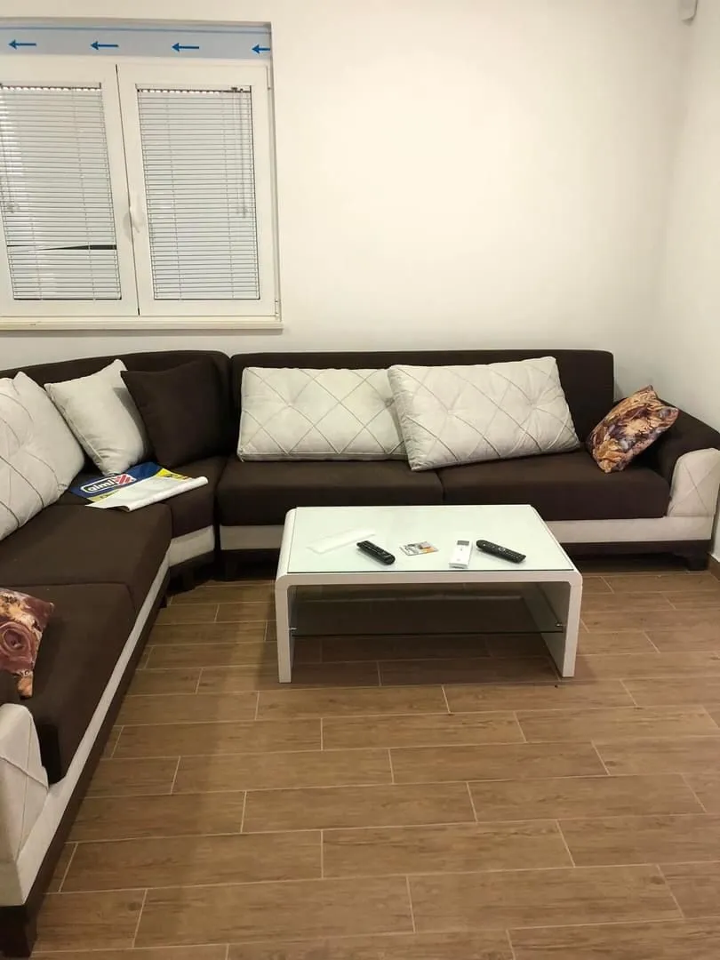 Living room with a sectional sofa and a coffee table.
