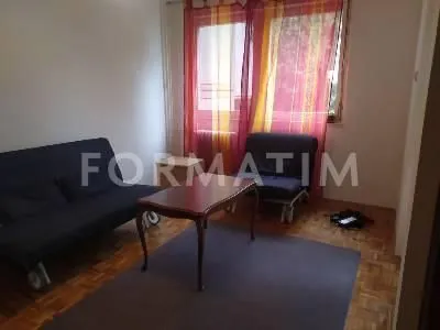 Living room with a seating set and a wooden coffee table. - image 8