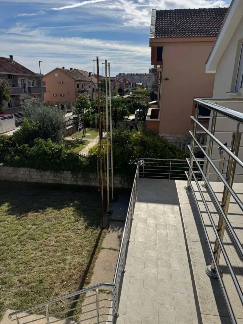 View from the terrace towards the yard and surrounding buildings.