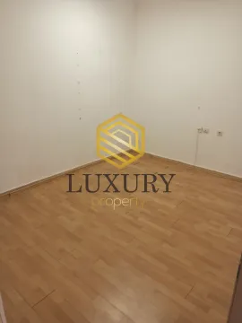 Empty room with laminate flooring and white walls. - image 7